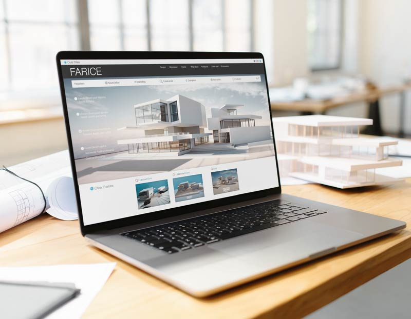 Laptop mit geöffneter Architekturbüro-Website auf einem Schreibtisch mit Architekturmodell und Plänen.